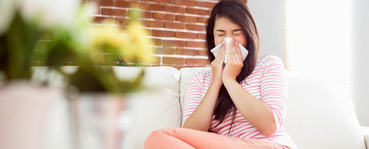 Photo of woman sneezing