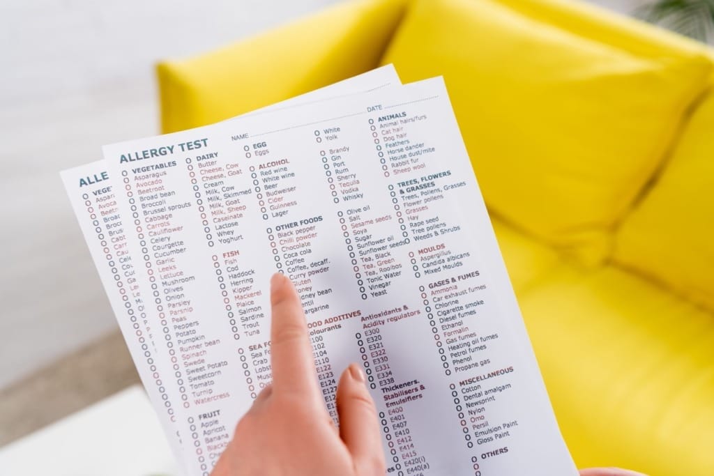 Patient reviewing comprehensive allergy test panel checklist